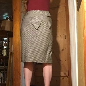 Vintage pencil skirt with bow and pleated back.